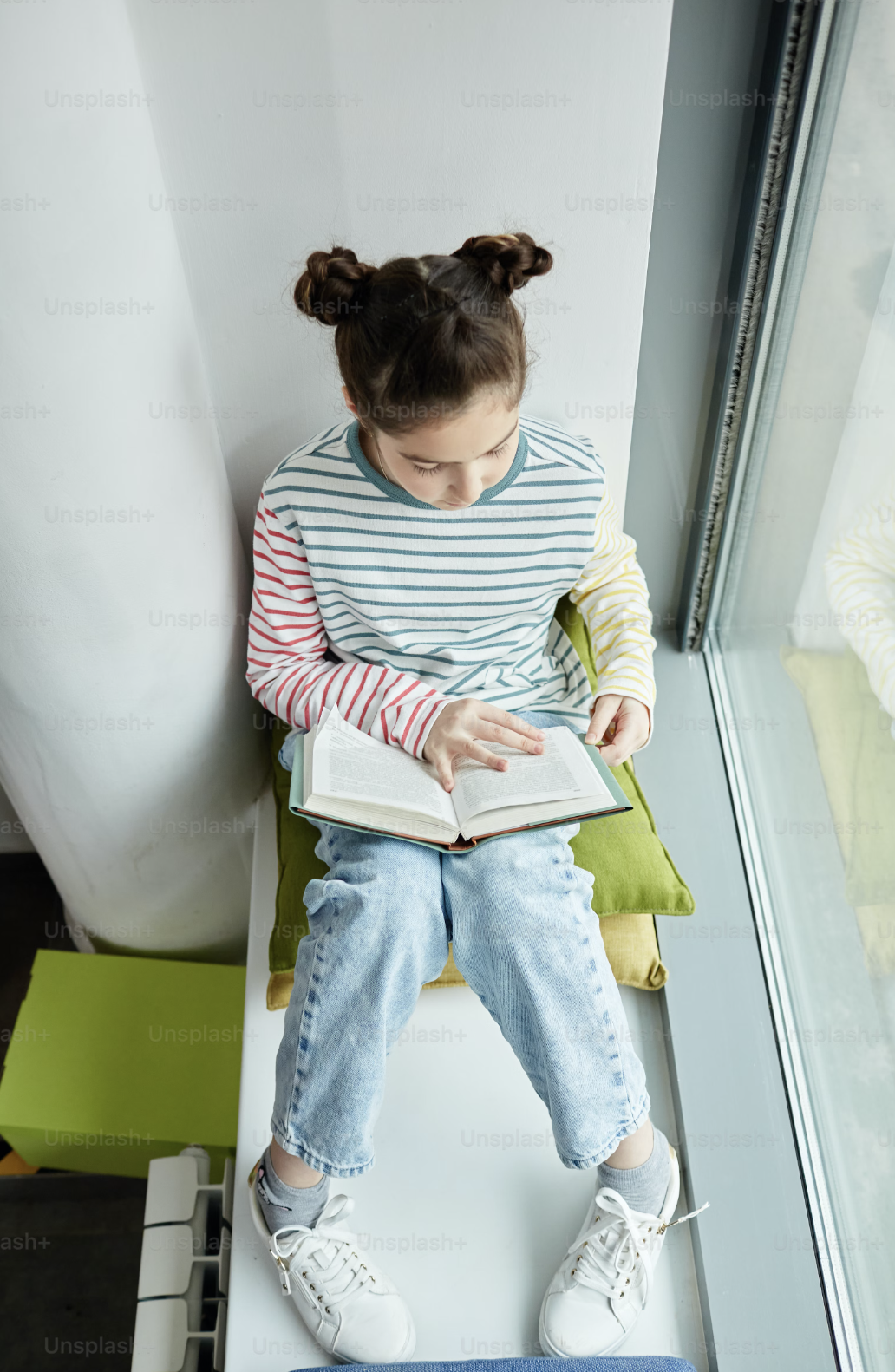 young girl reading a book